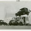 Automobiles - Death Dodgers - Car jumping over milk trucks