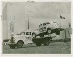 Automobiles - Death Dodgers - Car jumping over truck