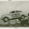 Automobiles - Death Dodgers - Car jumping over truck