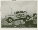 Automobiles - Death Dodgers - Car jumping over truck