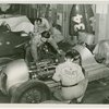 Automobiles - Grand Prix - Men tuning up cars
