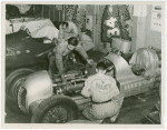 Automobiles - Grand Prix - Men tuning up cars