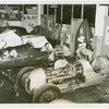 Automobiles - Grand Prix - Men tuning up cars