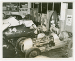 Automobiles - Grand Prix - Men tuning up cars