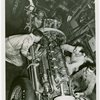 Automobiles - Grand Prix - Men tuning up car