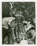 Automobiles - Grand Prix - Men tuning up car