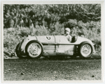 Automobiles - Grand Prix - Man driving an MG