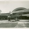 Aviation Exhibit - Two girls with replica of Piper Cub training plane