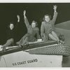 Three women on Coast Guard boat.