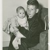 Boy holding baby