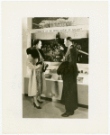 Bakelite Plastics Exhibit - Man and woman at aviation display