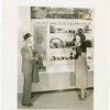 Bakelite Plastics Exhibit - Man and woman at automotive display
