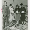 Ballantine - Carl W. Badenhausen with girls putting money in cornerstone