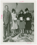 Ballantine - Carl W. Badenhausen with girls putting money in cornerstone