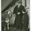 Borden - Jeffers, Henry (Inventor of Rotolactor, President of Walker-Gordon) - With granddaughter and cow