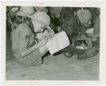 Boy Scouts - Boy writing on map