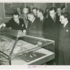 Brazil Participation - Howard Flanigan, Robert Kohn, Dr. Jose Carlos de Macedo Soares (Special Ambassador from Brazil), and group look at model