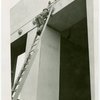 Business Systems and Insurance Building - Worker on ladder