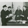 Customs men at Liddy's desk