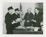Customs men at Liddy's desk