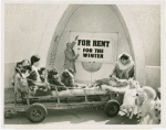 Carrier Corp. - Eskimos - Family and dogs outside of igloo