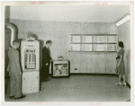 Carrier Corp. - Igloo - Interior - Two men and woman in basement