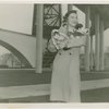 Cats - Woman holding cats at base of Trylon