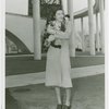 Cats - Woman holding cats at base of Trylon