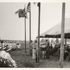 Ceremonies - Man under tent speaks to gathering