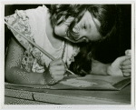 Children - Art Classes - Girl paints at table