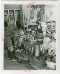 Children - Crippled Children's Outing - Boy Scout hands out milk
