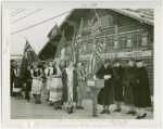 Children's World - Mrs. Herbert Hoover mails invitation while Mrs. Theodore Roosevelt Jr. and others look on in front of Girl Scout chalet.