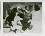 Children's World - Boy feeding bear cub