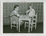 Children's World - Girl and doll at Shirley Temple's Glass Playhouse