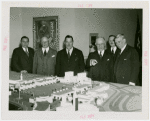 Chile Participation - Grover Whalen with others looking at model