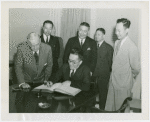 China Participation - Chinese Ambassador signing guestbook with Harvey Gibson