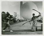 China Participation - Entertainers - Man with pole and woman with swords