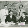 Christian Science - Grover Whalen signing contract with Christian Scientists executive committee chairman