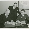 Christian Science - Harvey Gibson signing contract with Christian Scientists executive committee chairman