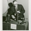 Communications - Exhibits - Man demonstrating film apparatus