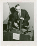 Communications - Exhibits - Man demonstrating film apparatus