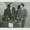 Communications - Exhibits - Men demonstrating film apparatus