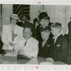 Connecticut Day - Raymond Baldwin signing guest register with family