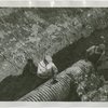 Construction - Men laying sewer pipes