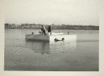 Construction - Men on float in lake