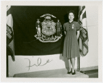 Contests - Woman posed in front of flag