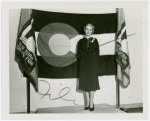 Contests - Woman posed in front of Colorado flag