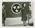 Contests - Woman posed in front of Tennessee flag