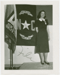 Contests - Woman posed in front of North Carolina flag