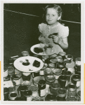 Contests - Girl sampling Jam and Jelly World's Series winners